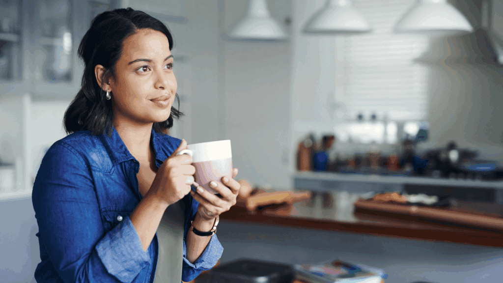 A gentle photo of a woman pausing thoughtfully, symbolizing reflection of setting boundaries