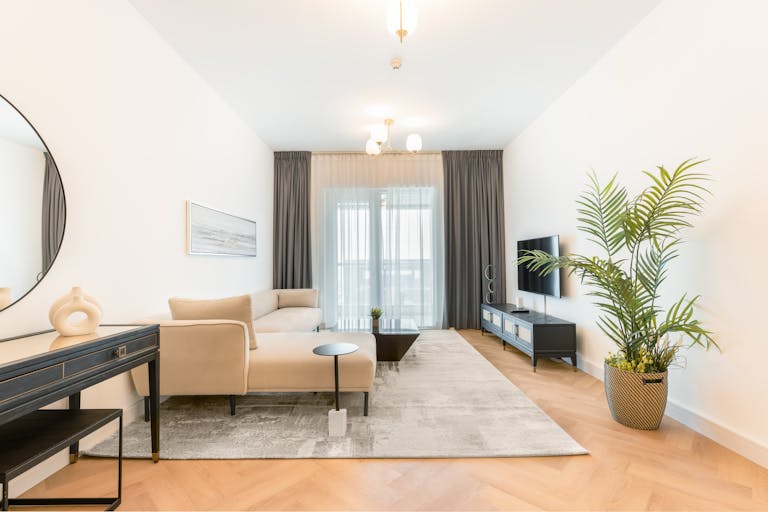 Minimalist living room with cozy sofa and calming neutral tones