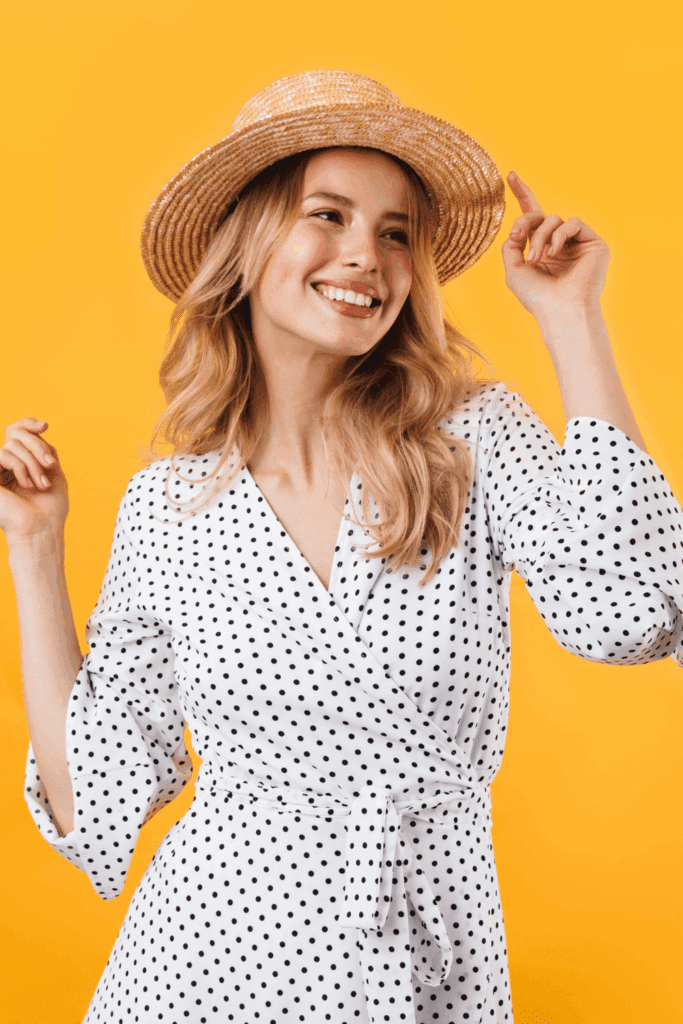 Woman smiling in stylish faux wrap dress