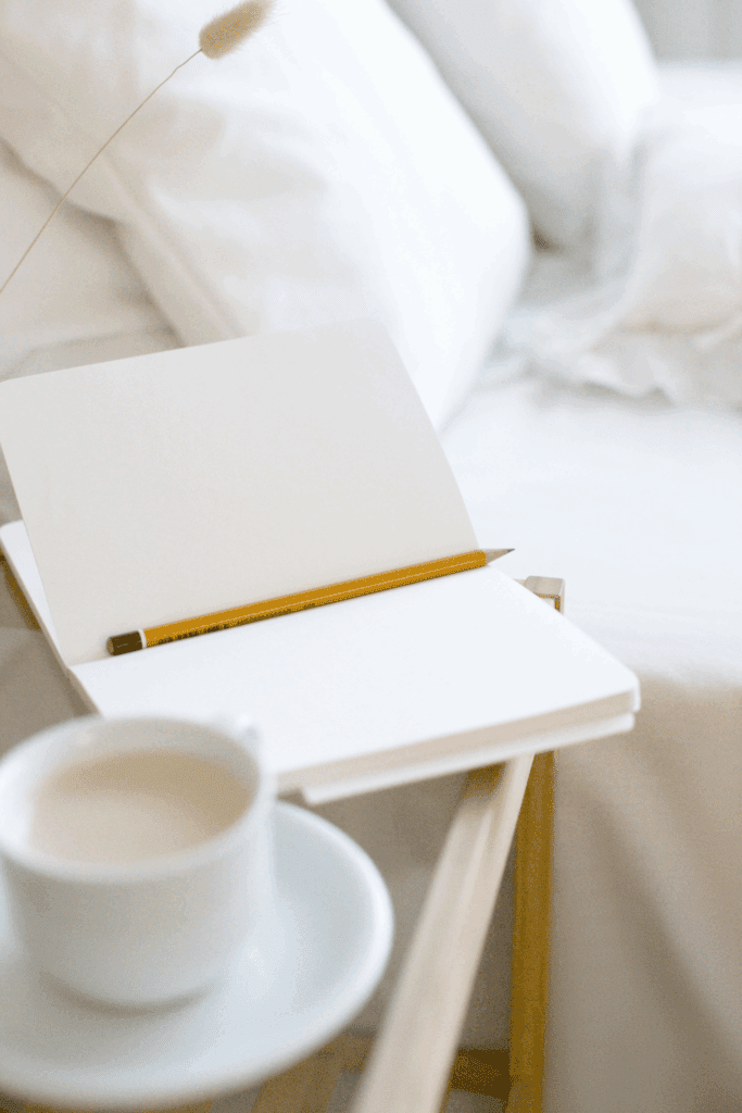 A cozy desk setup with a notebook open