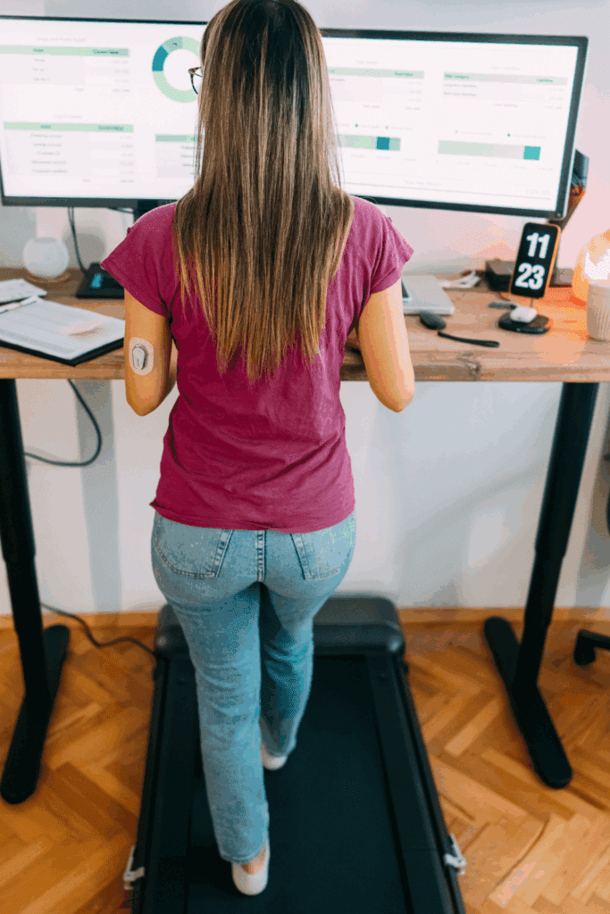 Woman using a standing desk  to increase movements and Boost Energy Naturally