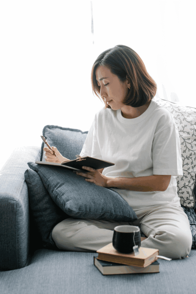 woman journaling to overcome fear of making wrong decisions